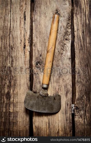 Old carving knife . On a wooden background.. Old carving knife . On wooden background.