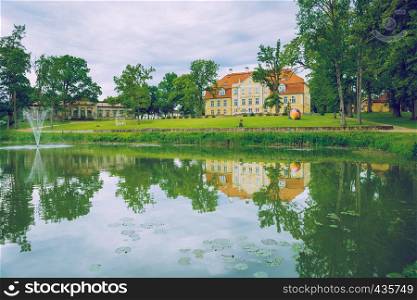 Old castle at Latvia, city Malpils. View from lake to castlle. 2015