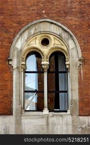 old castle brick brown and window reflex in piazza dei mercanti milan