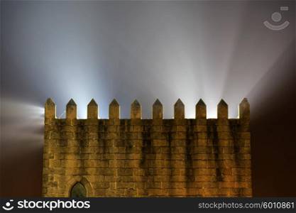 Old castle wall with illumination in Porto, Portugal