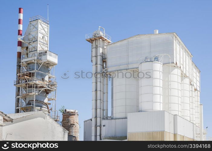 Old cement plant. Preheating tower and storage silos