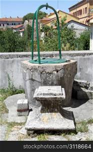 Old cement well in the inner yard of Franciscan monastery in Pazin, Istria, Croatia