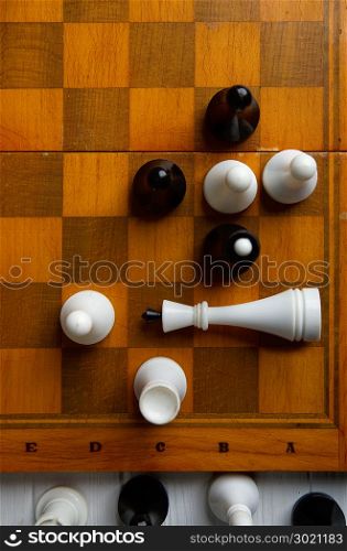 old chess on a chess classic wooden board on a dark background. chess on a chessboard
