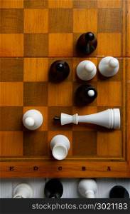 old chess on a chess classic wooden board on a dark background. chess on a chessboard