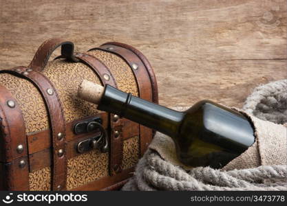 old chest and a bottle of wine, still life