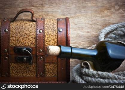 old chest and a bottle of wine, still life