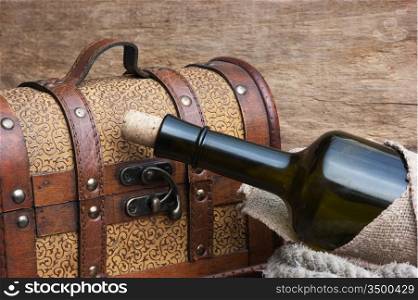 old chest and a bottle of wine, still life