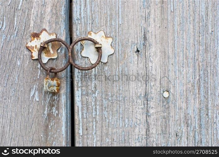 Old chinese doorknocker and wooden textured door