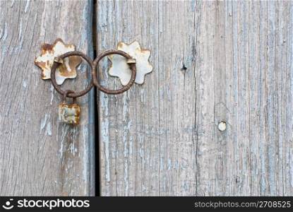 Old chinese doorknocker and wooden textured door