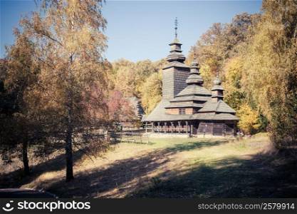 Old church in autumn forest
