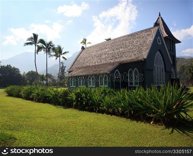 Old church in town of Hanalei on Kauai in Hawaii against the misty mountain backdrop