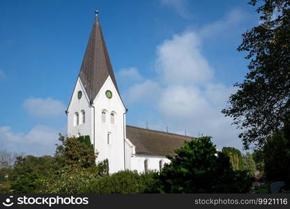 Old church of Nebel against blue sky, Amrum, Germany