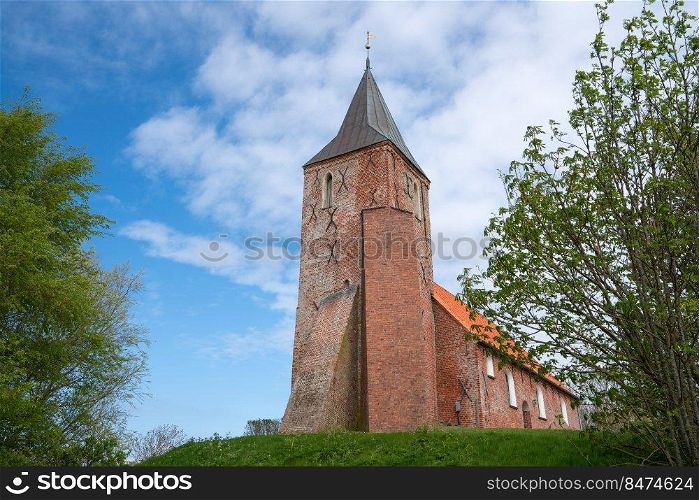 Old church of Westerhever against blue sky, North Frisia, Germany