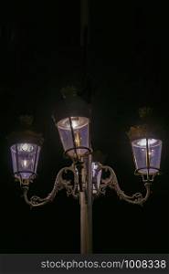 old city center street lamp in the night