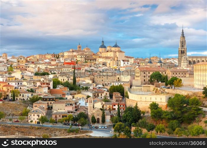 Old city of Toledo with Primate Cathedral of Saint Mary, churches of San Ildelfonso, San Roman and Santo Tome at sunset, Castilla La Mancha, Spain