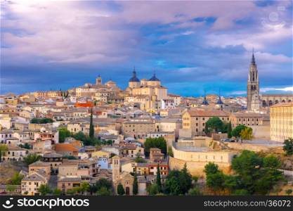 Old city of Toledo with Primate Cathedral of Saint Mary, churches of San Ildelfonso, San Roman and Santo Tome at sunset, Castilla La Mancha, Spain.