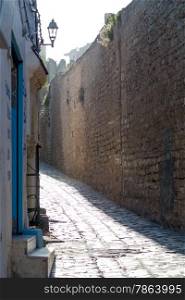 Old City Wall with Cobblestone Alleyway