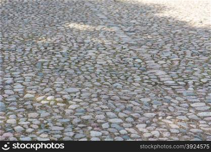 Old cobble stone background. Background of an old cobble stone pavement with line pattern