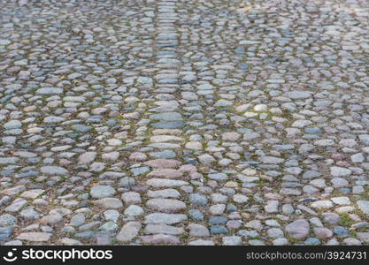 Old cobble stone background. Background of an old cobble stone pavement with line pattern