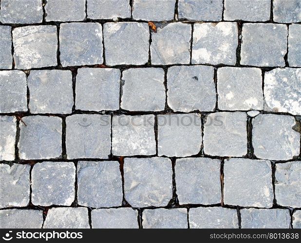 Old cobblestone road. Abstract background. Close up.