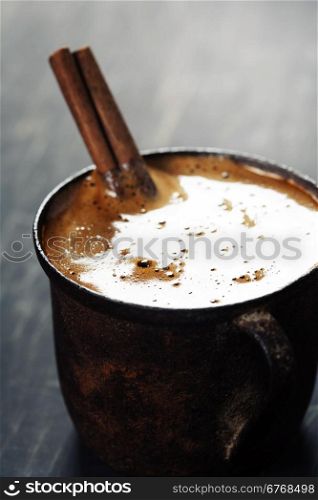Old coffee cup on dark rustic background