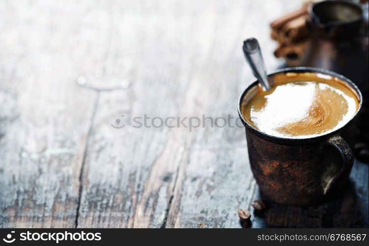 Old coffee cup on dark rustic background