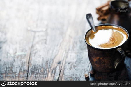 Old coffee cup on dark rustic background