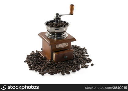 old coffee grinder filled with beans for a good coffee