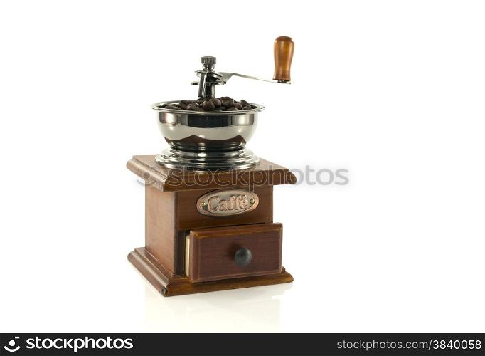 old coffee grinder filled with beans for a good coffee