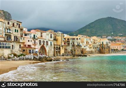 Old colorful houses by the sea in Cefalu, Sicily, Italy