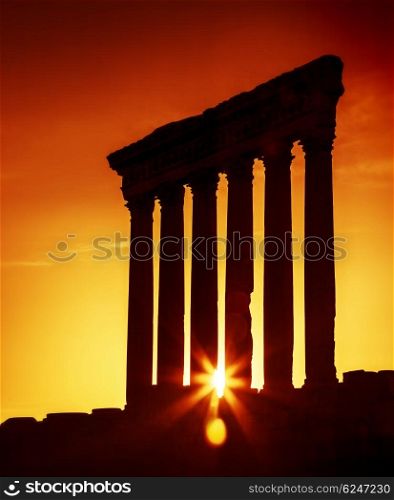 Old columns over sunset, Jupiter&rsquo;s temple of Baalbek, Lebanon, ancient city ruins,hystorical arabian architecture, travel and tourism concept
