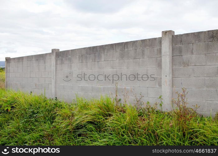 Old concrete wall with a gray sky background