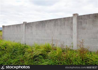 Old concrete wall with a gray sky background