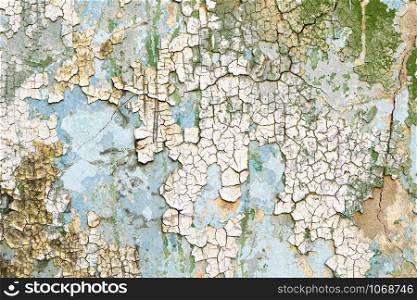 Old concrete wall with peeling paint. Peeled plaster background.