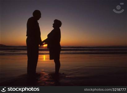 Old Couple at the Beach at Sunset