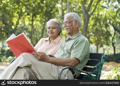 Old couple reading a document