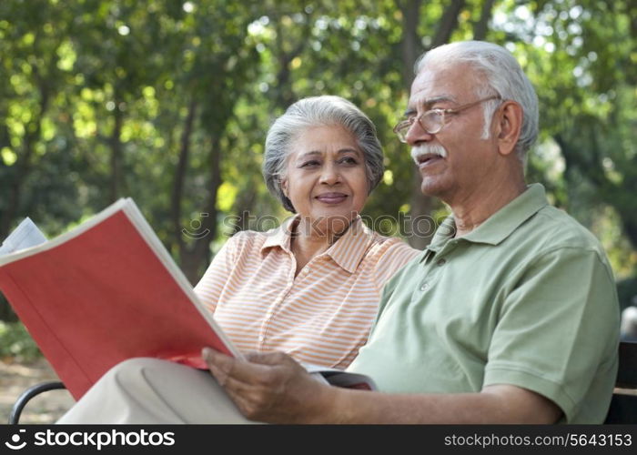 Old couple sitting on a bench