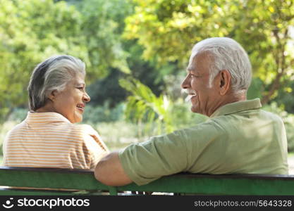 Old couple sitting on a bench