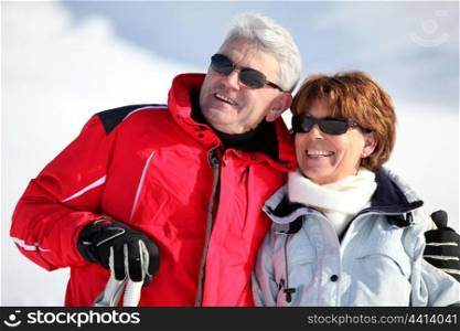 old couple skiing