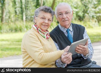 old couple with a tab