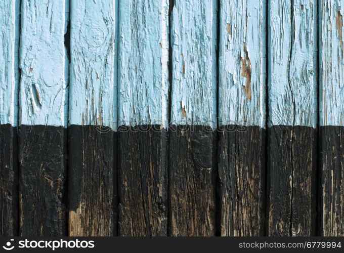 Old cracked paint on old boards. Wooden wall