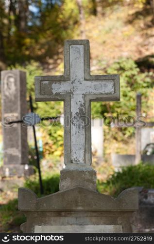 Old cross on a cemetery. Since its creation in 1787 Lychakiv Cemetery Lvov, Ukraine.