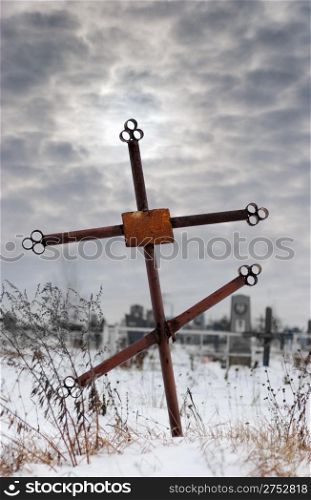 old cross on a cemetery. The drama sky on a background