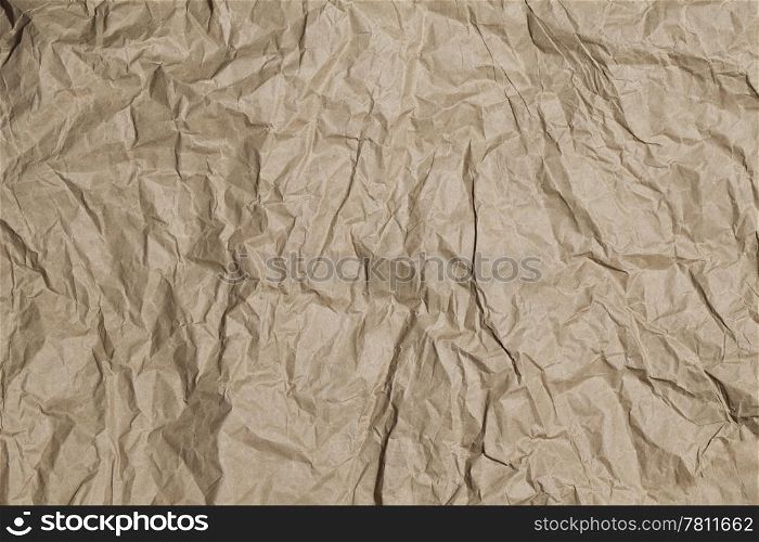 Old crumpled brown paper background texture.