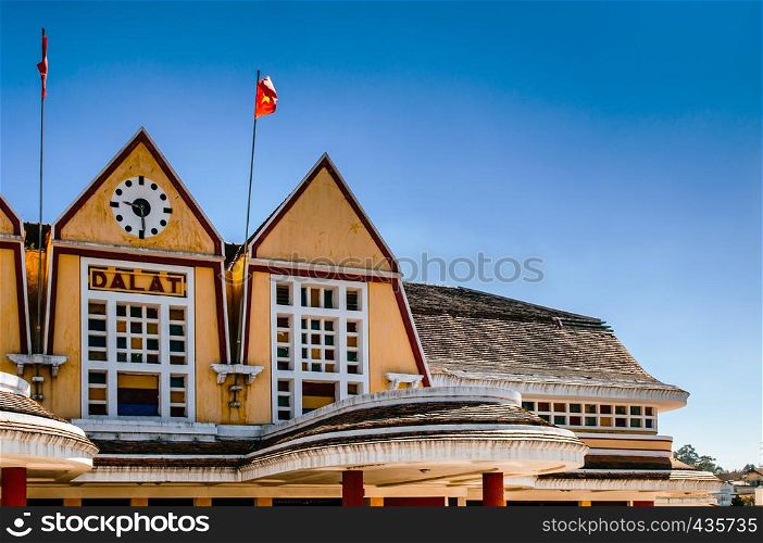 Old Dalat railway station - Vietnam. French colonial style building with yellow facade, Station was designed in 1932 by French architects Moncet and Reveron.