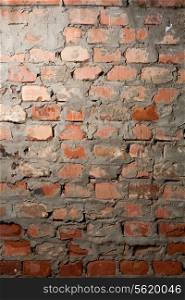 Old damaged aged Brick wall closeup backdrop. Red brick wall closeup background. Closeup of old brick wal