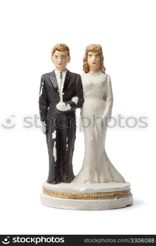 Old damaged plaster bride and groom cake topper