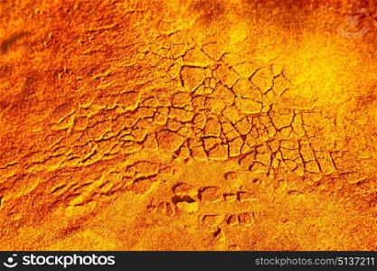 old desert and the abstract cracked sand texture in oman rub al khali