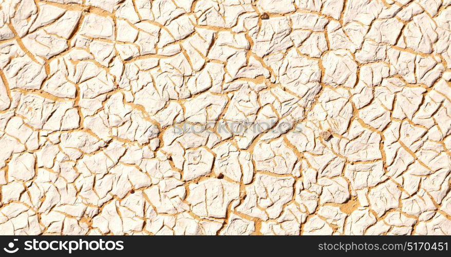 old desert and the abstract cracked sand texture in oman rub al khali