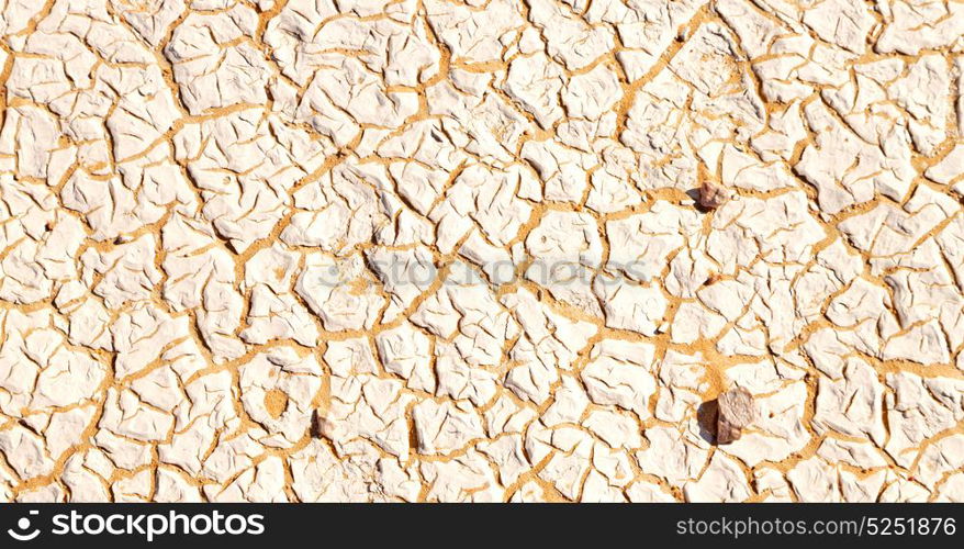 old desert and the abstract cracked sand texture in oman rub al khali